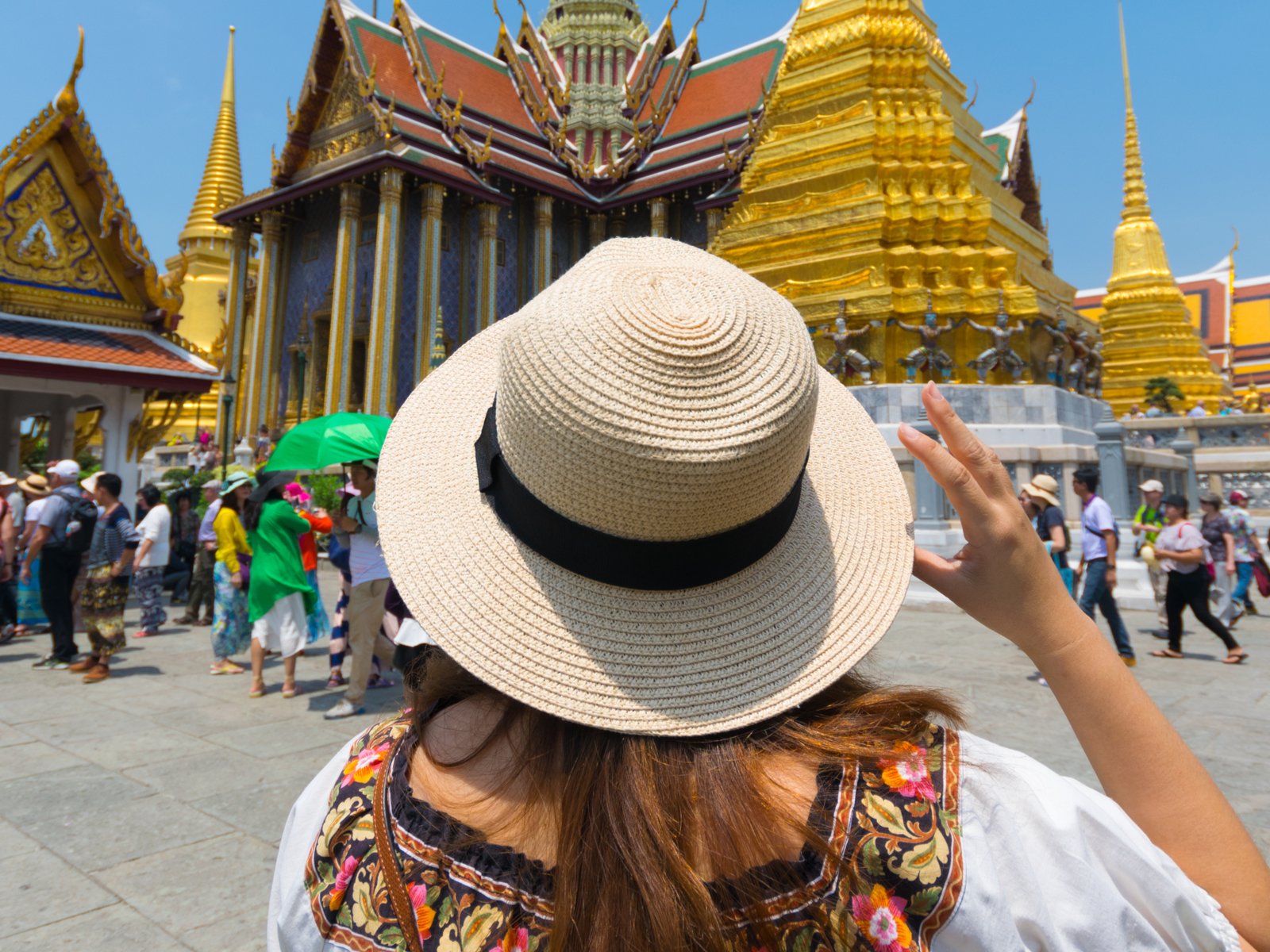 A tourist in Wat Phra Kaew in Bangkok, Thailand.
