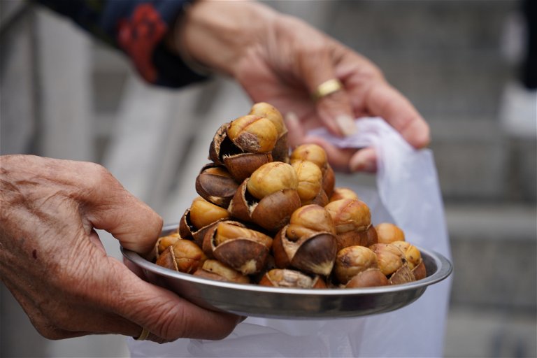A woman selling chestnuts in China, the world's largest producer.