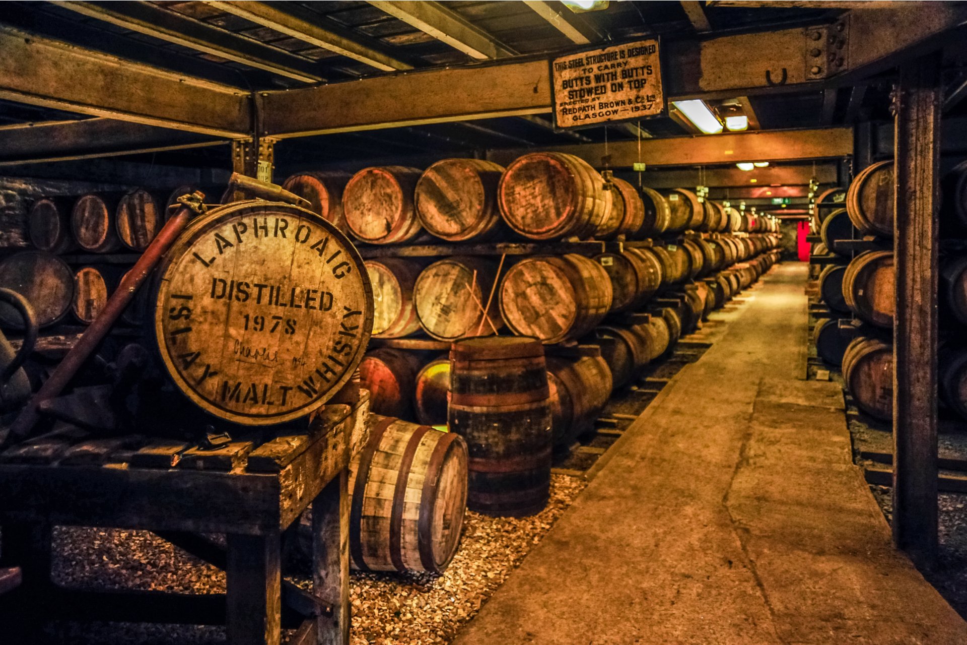 Whisky maturing in barrels at the famed Laphroaig Distillery, Scotland