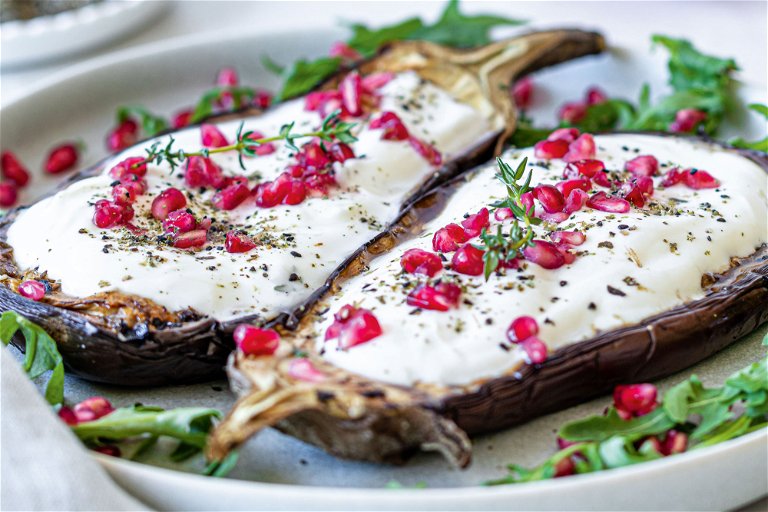 Grilled aubergines with yoghurt and pomegranate seeds are the ideal accompaniment to spicy grilled meat.