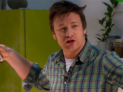A file shot of Jamie Oliver cooking in 2012.