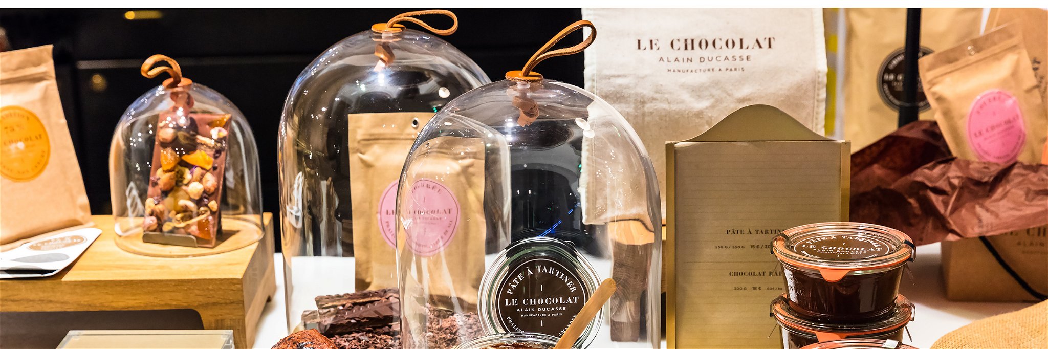 Different kinds of premium chocolate products by Alain Ducasse on display in a French supermarket.