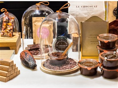 Different kinds of premium chocolate products by Alain Ducasse on display in a French supermarket.