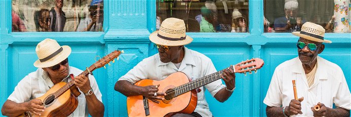 Street musicians playing traditional Cuban music on the street in old Havana, Cuba.