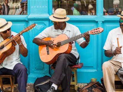Street musicians playing traditional Cuban music on the street in old Havana, Cuba.