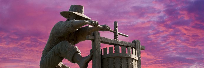 Famous Napa Valley grape crusher statue: The most important tool the wine industry possesses is unity.