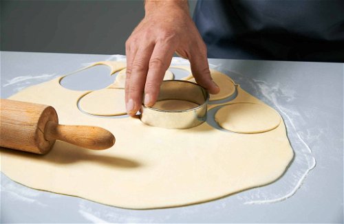 Roll out the pasta dough and cut out even circles with a doughnut cutter.