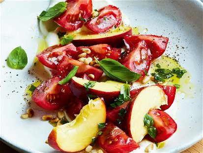 Tomato &amp; Peach Salad on a bed of cream cheese with a basil vinaigrette