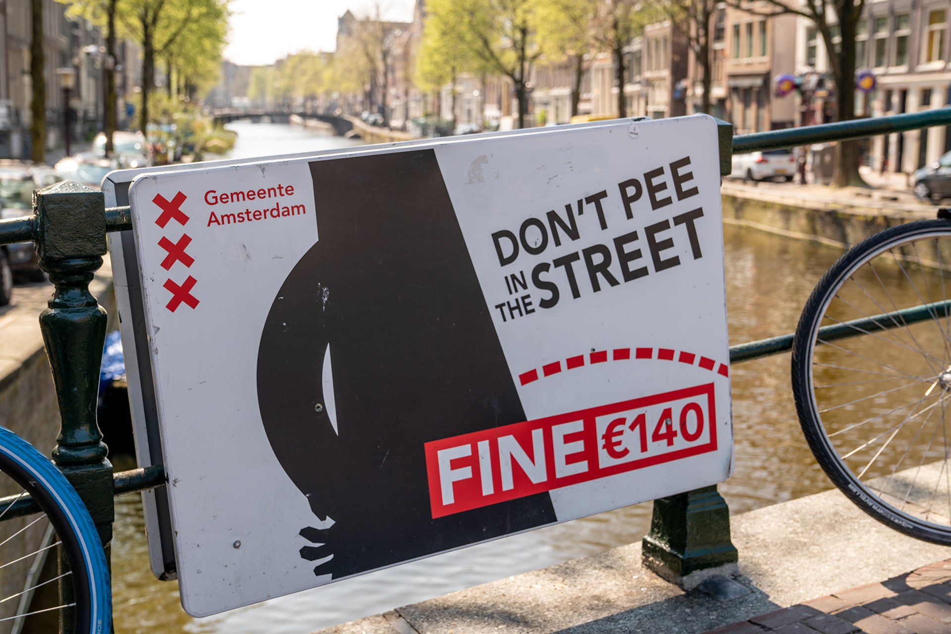 Warning sign in English language in Red Light District in Amsterdam.
