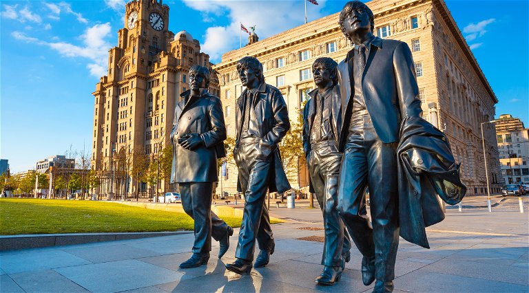 Bronze statue of the  Beatles stands at the Pier Head.