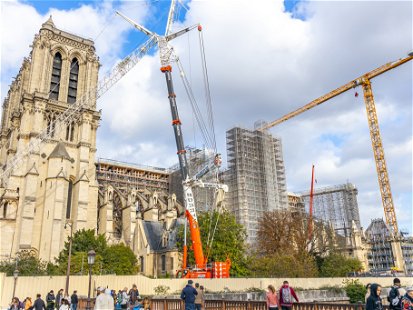 Paris, France - October 2022 : Notre-Dame de Paris cathedral under reconstruction and renovation with some people visiting