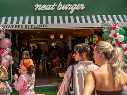 New York NY USA-April 22, 2023 Hundreds attend the opening of the first US branch of the UK based Neat Burger meatless restaurant chain in the Nolita neighborhood of New York