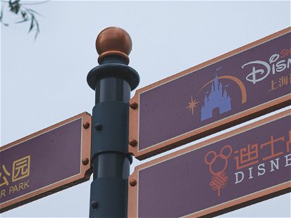 SHANGHAI, CHINA - Jul 15, 2022: A closeup of Shanghai Downtown Disneyland Direction Sign against the sky in Pudong, China