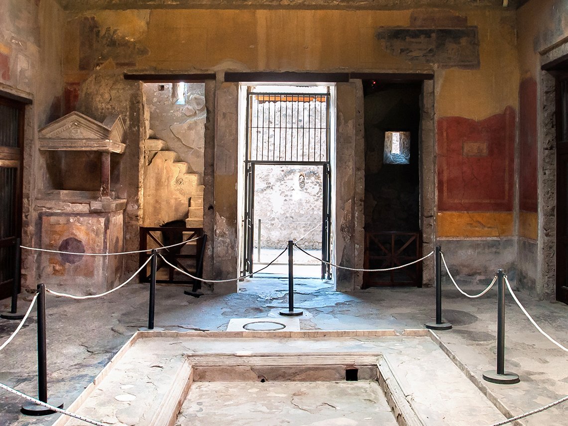 Entrance vestibule inside the of the House of Menander, Pompeii, Italy. The impluvium in the middle of the floor was designed to carry away rainwter coming through the roof.