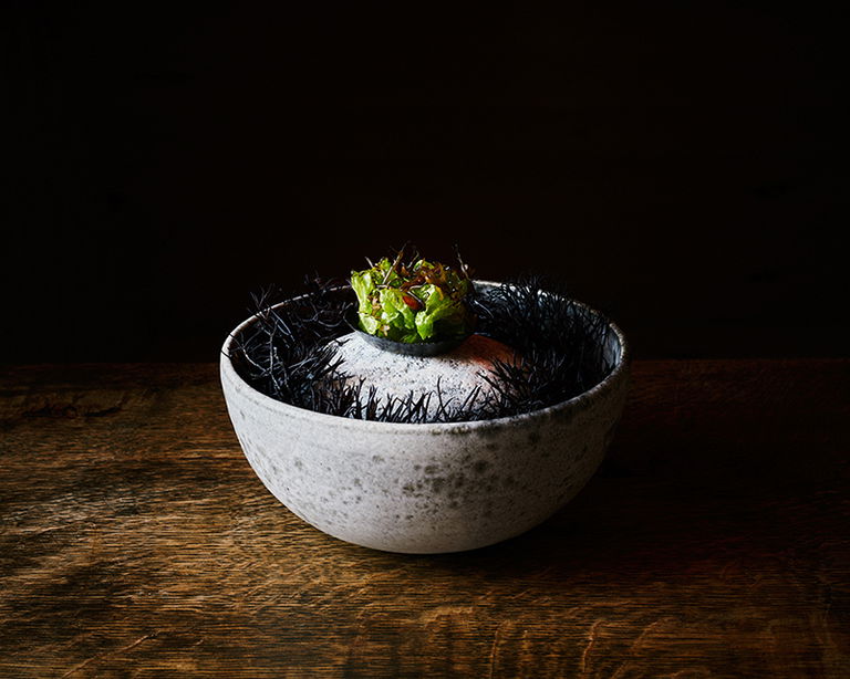 Seal blood tartlette with blue mussel and seaweed.