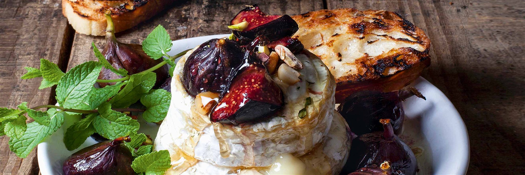 Baked Camembert with figs, macadamia brittle and honey