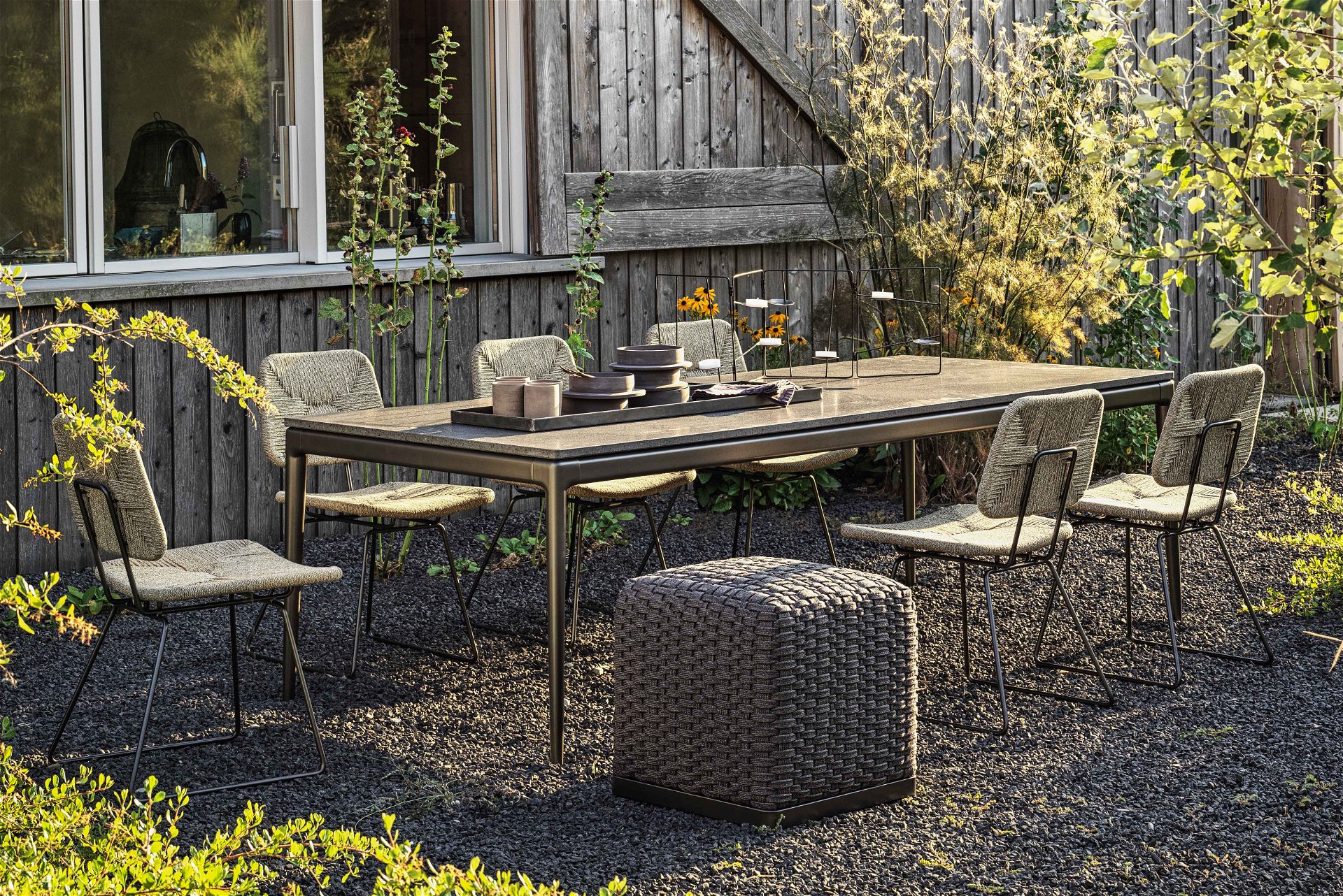 Echoes Outdoor dining chair, Pico Outdoor table, Phuket ottoman.