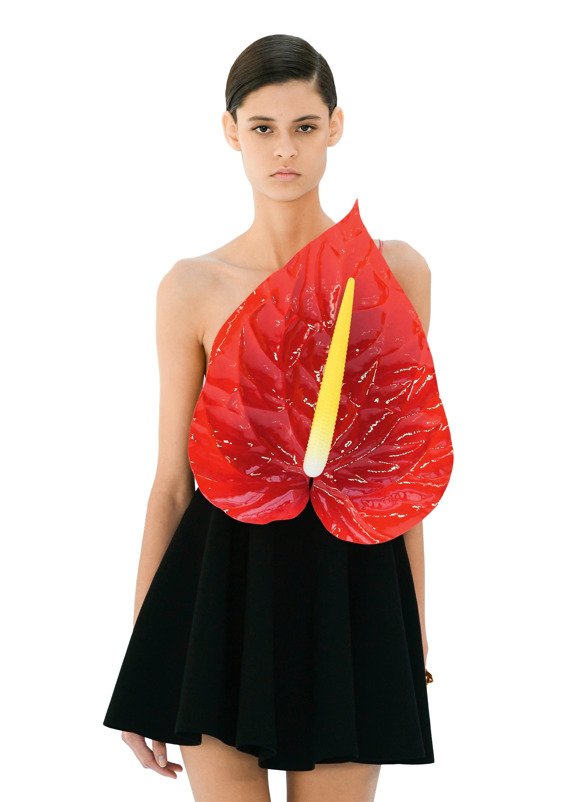 Designer Jonathan Anderson lässt für Loewes Spring 2023 Ready-to-wear eine Flamingoblume aus Kleidern wachsen. loewe.com